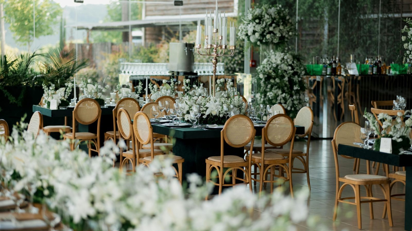 Long dining tables with white flowers